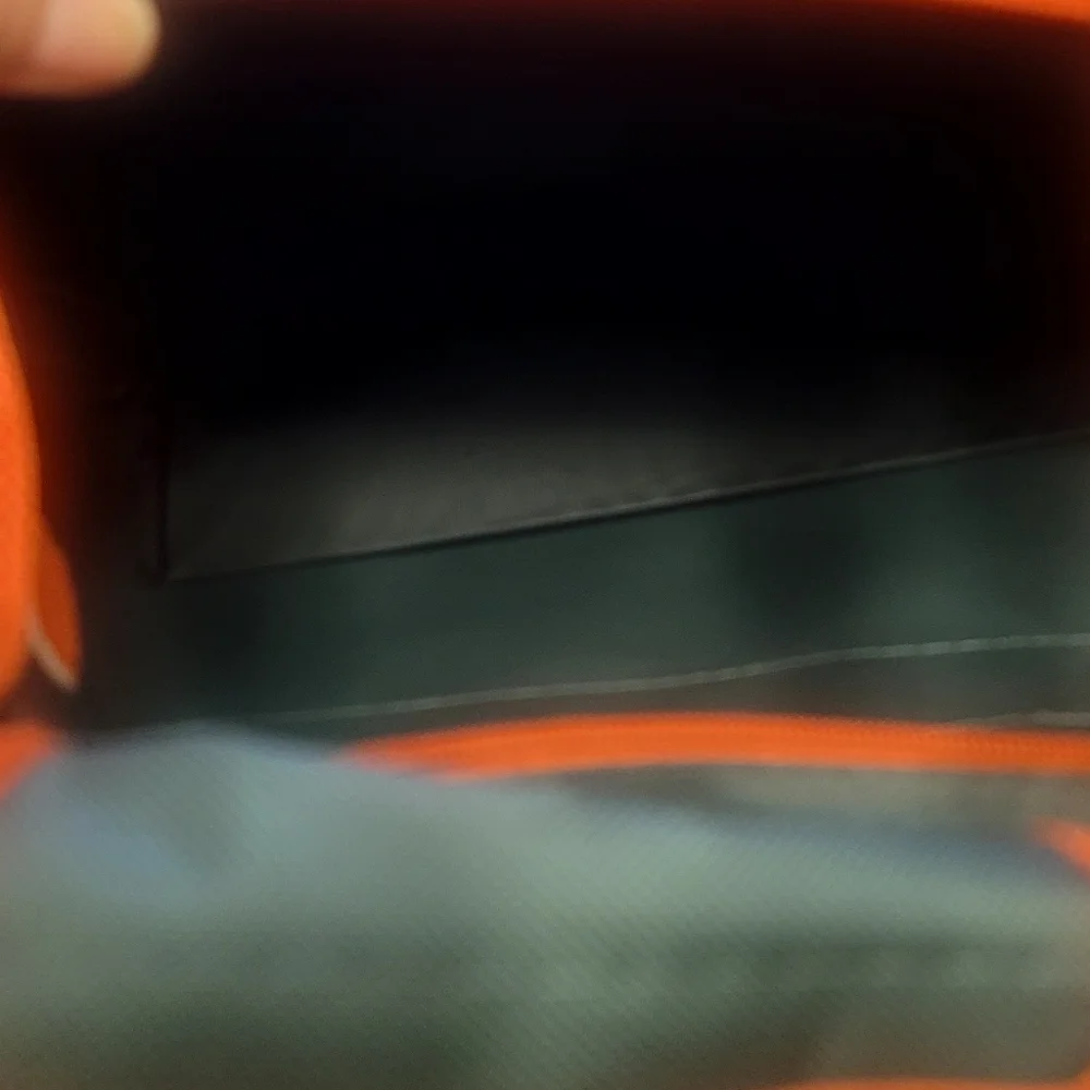 Vibrant Green and Orange Travel Bags for Adventurers